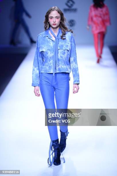 Model showcases designs on the runway at COTTON USA show by designers Chen Wen & Adriano Goldschmied on day four of Mercedes-Benz China Fashion Week...