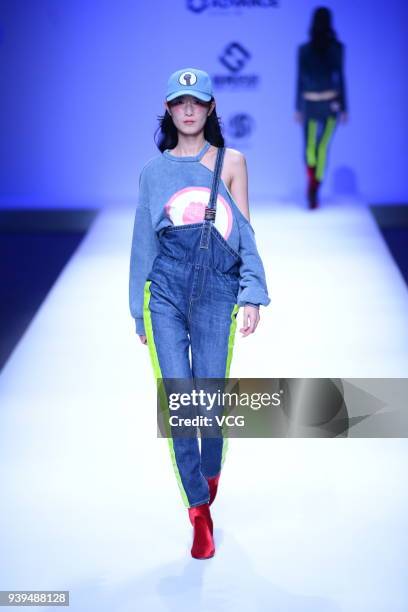 Model showcases designs on the runway at COTTON USA show by designers Chen Wen & Adriano Goldschmied on day four of Mercedes-Benz China Fashion Week...