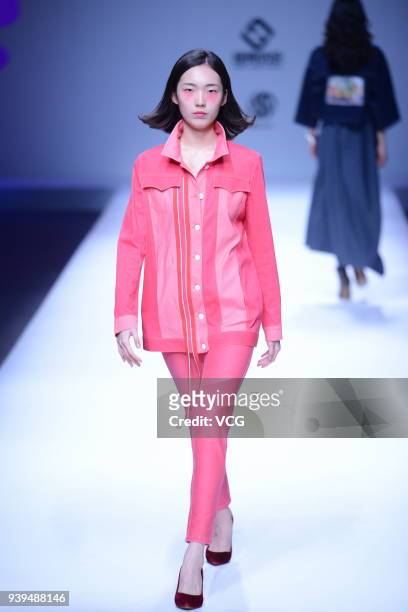 Model showcases designs on the runway at COTTON USA show by designers Chen Wen & Adriano Goldschmied on day four of Mercedes-Benz China Fashion Week...