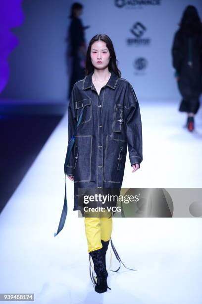 Model showcases designs on the runway at COTTON USA show by designers Chen Wen & Adriano Goldschmied on day four of Mercedes-Benz China Fashion Week...