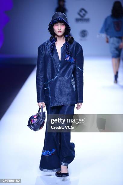 Model showcases designs on the runway at COTTON USA show by designers Chen Wen & Adriano Goldschmied on day four of Mercedes-Benz China Fashion Week...