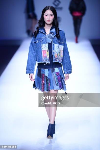 Model showcases designs on the runway at COTTON USA show by designers Chen Wen & Adriano Goldschmied on day four of Mercedes-Benz China Fashion Week...