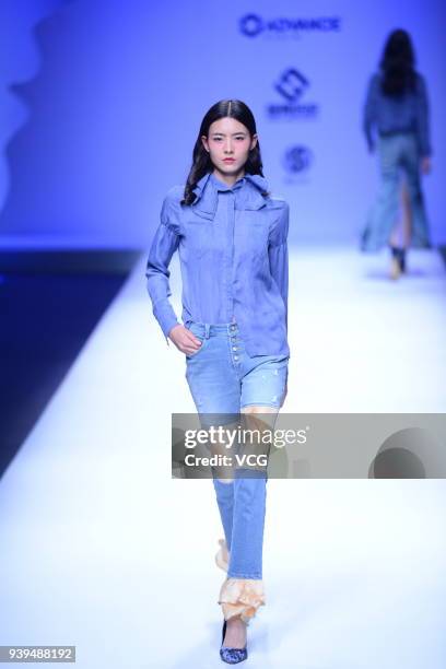 Model showcases designs on the runway at COTTON USA show by designers Chen Wen & Adriano Goldschmied on day four of Mercedes-Benz China Fashion Week...