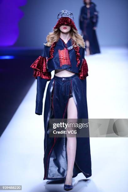 Model showcases designs on the runway at COTTON USA show by designers Chen Wen & Adriano Goldschmied on day four of Mercedes-Benz China Fashion Week...