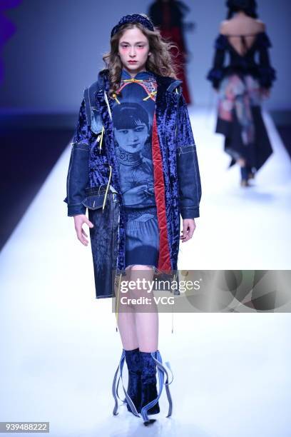 Model showcases designs on the runway at COTTON USA show by designers Chen Wen & Adriano Goldschmied on day four of Mercedes-Benz China Fashion Week...