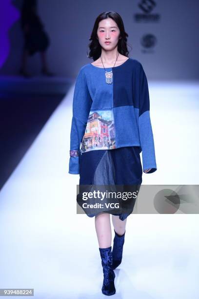 Model showcases designs on the runway at COTTON USA show by designers Chen Wen & Adriano Goldschmied on day four of Mercedes-Benz China Fashion Week...