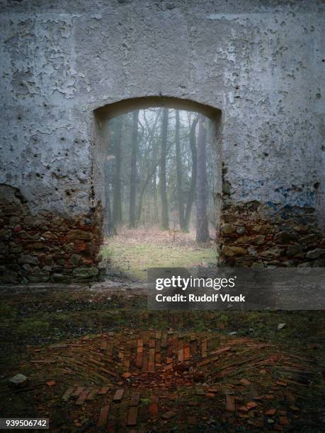 abandoned old ruin of a chapel, brick wall falling apart, stucco peeling off - peeling off bildbanksfoton och bilder