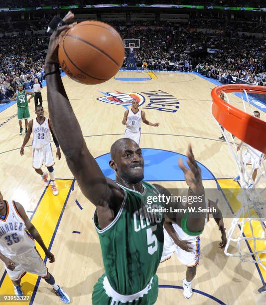 Kevin Garnett of the Boston Celtics goes up for a dunk against the Oklahoma City Thunder at the Ford Center on December 4, 2009 in Oklahoma City,...