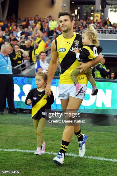 Trent Cotchin of the Tigers runs onto the ground prior to the round two AFL match between the Adelaide Crows and the Richmond Tigers at Adelaide Oval...