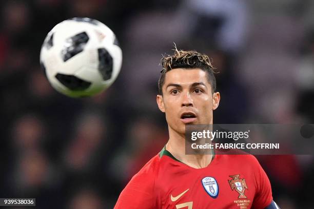 Portugal's forward Cristiano Ronaldo eyes the ball during the international friendly football match between Portugal and Netherlands at Stade de...