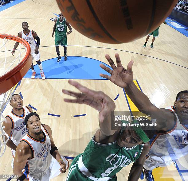Rajon Rondo of the Boston Celtics goes to the basket against Kevin Durant of the Oklahoma City Thunder at the Ford Center on December 4, 2009 in...