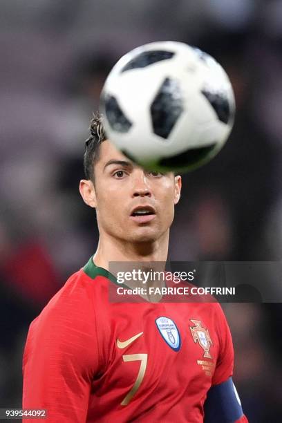 Portugal's forward Cristiano Ronaldo eyes the ball during the international friendly football match between Portugal and Netherlands at Stade de...