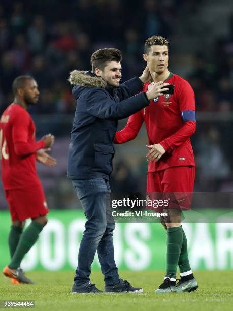 Fan makes selfie with Cristiano Ronaldo of Portugal during the International friendly match match between Portugal and The Netherlands at Stade de...