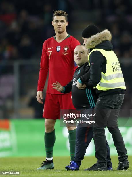 Pitch intruder with Cristiano Ronaldo of Portugal during the International friendly match match between Portugal and The Netherlands at Stade de...
