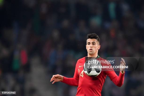 Portugal's defender Joao Cancelo controls the ball during the international friendly football match between Portugal and Netherlands at Stade de...