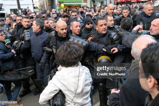 President of the French far-right Front National party Marine Le Pen is prevented by other demonstrators to participate in a silent march in Paris on...