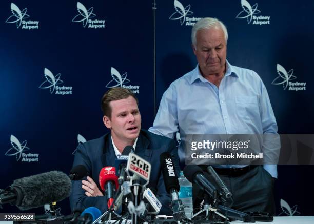 An emotional Steve Smith is comforted by his father Peter as he fronts the media at Sydney International Airport on March 29, 2018 in Sydney,...