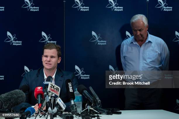 An emotional Steve Smith is comforted by his father Peter as he confronts the media at Sydney International Airport on March 29, 2018 in Sydney,...