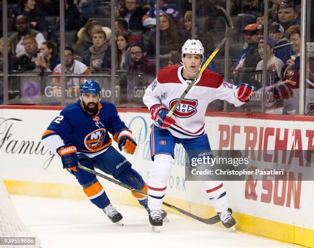 Nick Leddy of the New York Islanders skates against Mike Reilly of the Montreal Canadiens during the first period at Barclays Center on March 2, 2018...