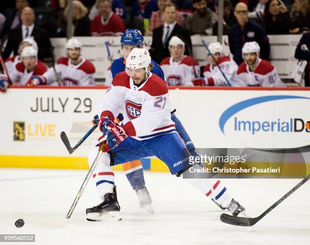 Alex Galchenyuk of the Montreal Canadiens skates against Brock Nelson of the New York Islanders during the second period on March 2, 2018 in New York...