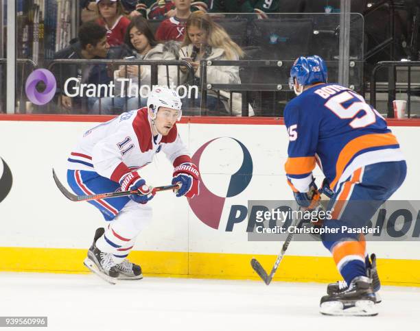 Brendan Gallagher of the Montreal Canadiens skates against Johnny Boychuk of the New York Islanders during the second period at Barclays Center on...