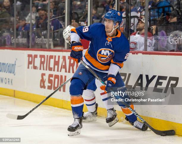 Brock Nelson of the New York Islanders controls the puck during the third period against the Montreal Canadiens at Barclays Center on March 2, 2018...