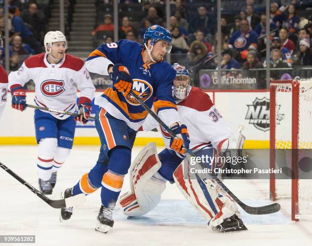 Brock Nelson of the New York Islanders skates against Charlie Lindgren of the Montreal Canadiens during the third period at Barclays Center on March...