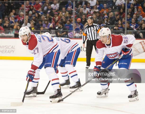 Alex Galchenyuk and Noah Juulsen of the Montreal Canadiens prepare for a face off during the third period against the New York Islanders at Barclays...