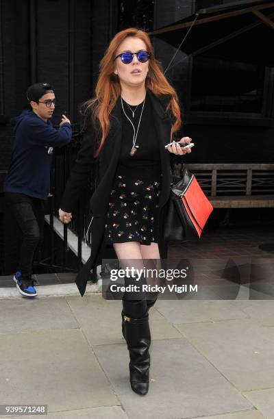 Lindsay Lohan is seen leaving her hotel to go for a walk around Mayfair on June 2, 2014 in London, England.