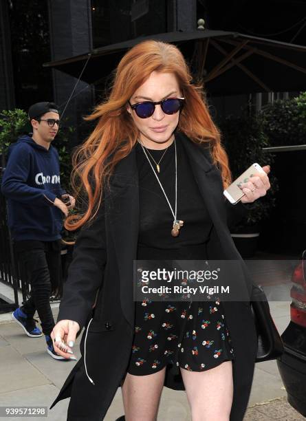 Lindsay Lohan is seen leaving her hotel to go for a walk around Mayfair on June 2, 2014 in London, England.