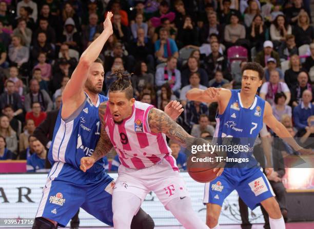 Jonas Wohlfarth-Bottermann of Fraport Skyliners and Julian Gamble of Bonn battle for the ball during the Basketball Bundesliga match between Telekom...