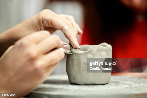 artist's hands making cup with clay at studio - potters wheel stock pictures, royalty-free photos & images
