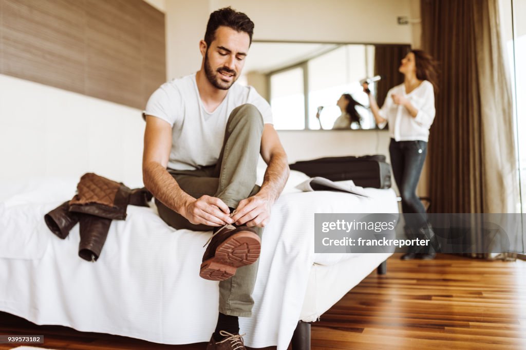 Man dressing up in the hotel room