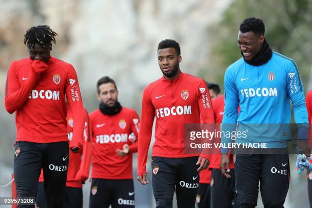 Monaco's French defender Kevin Ndoram, Monaco's French midfielder Thomas Lemar, and Monaco's French goalkeeper Loic Badiashile arrive for a training...
