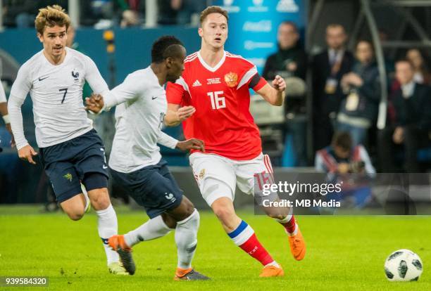 Antoine Griezmann , and Blaise Matuidi of France fight for the ball with Russia's Anton Shvets during the International friendly football match at...