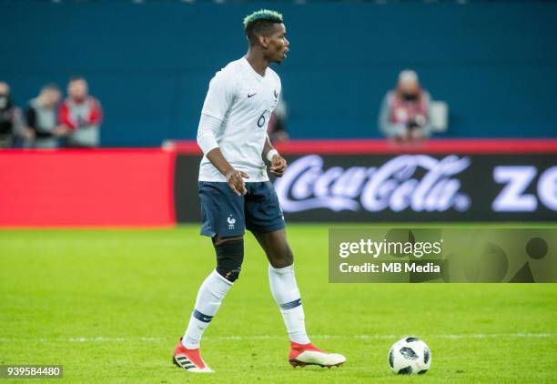 France's Paul Pogba plays the ball during the International friendly football match at Saint Petersburg Stadium on March 27, 2018 in...