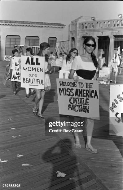 On the Atlantic City Boardwalk, demonstrators, many with posters, protest the Miss America beauty pageant, Atlantic City, New Jersey, September 7,...