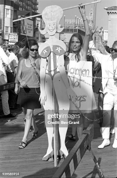 On the Atlantic City Boardwalk, a demonstrator operates a marionette as she protests the Miss America beauty pageant, Atlantic City, New Jersey,...