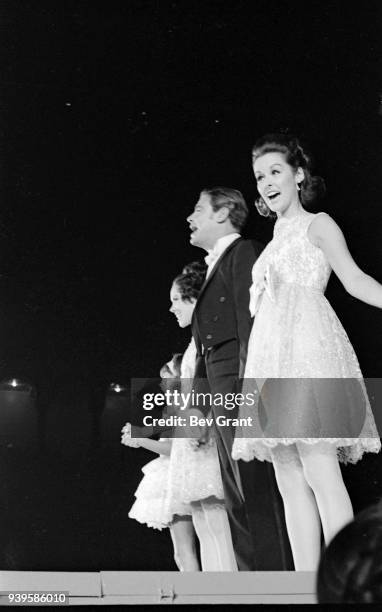 American performer and Miss America beauty pageant host Bert Parks , along with several unidentified women sing onstage at Boardwalk Hall during the...