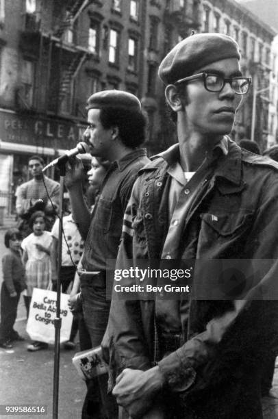 View of the Young Lords Party's Minister of Health Carlito Rovira as the group's Minister of Education, Carlos Aponte , speaks to people on an East...