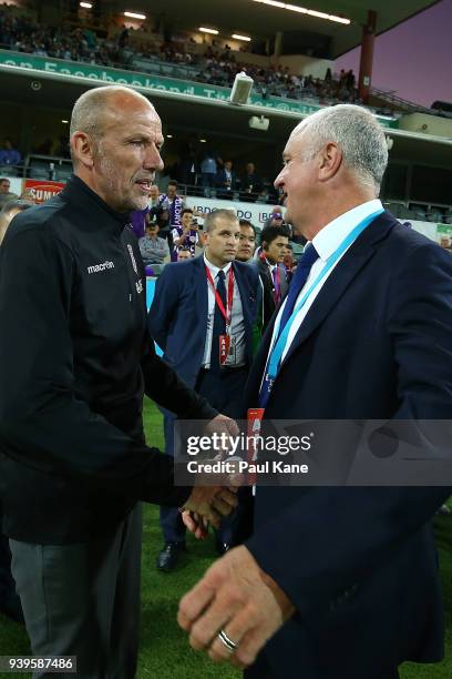 Kenny Lowe, head coach of the Glory and Graham Arnold, head coach of Sydney shakes hands before the round 25 A-League match between the Perth Glory...