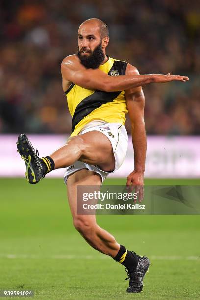 Bachar Houli of the Tigers kicks the ball during the round two AFL match between the Adelaide Crows and the Richmond Tigers at Adelaide Oval on March...