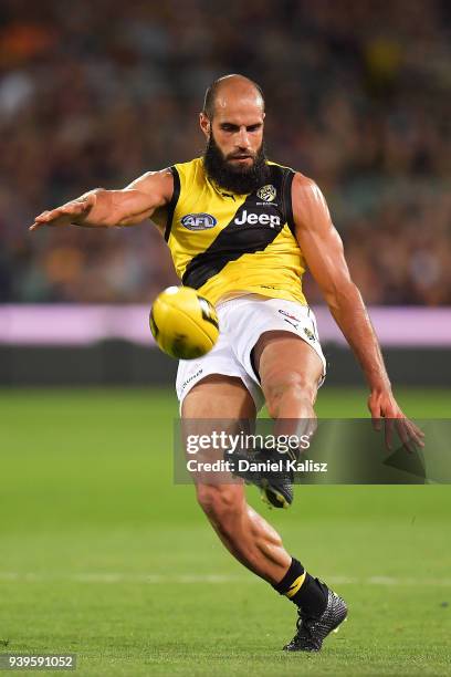 Bachar Houli of the Tigers kicks the ball during the round two AFL match between the Adelaide Crows and the Richmond Tigers at Adelaide Oval on March...