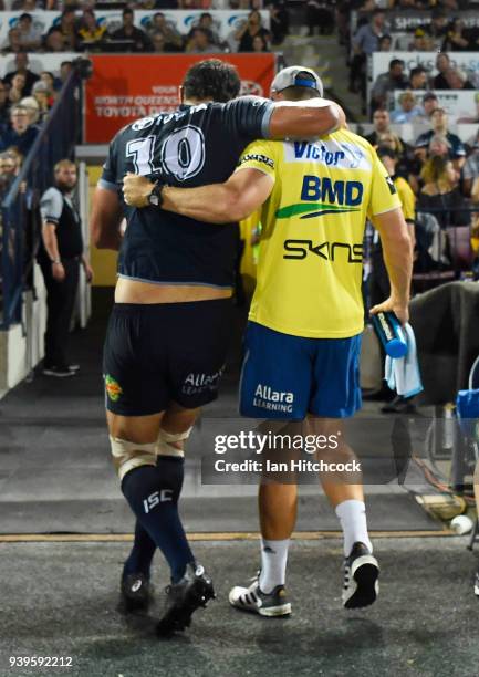 Jordan McLean of the Cowboys comes from the field after being injured during the round four NRL match between the North Queensland Cowboys and the...