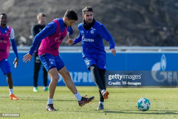 Franco Di Santo of Schalke and Pablo Insua of Schalke battle for the ball during a training session at the FC Schalke 04 Training center on March 26,...