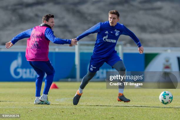 Sascha Riether of Schalke and Bastian Oczipka of Schalke battle for the ball during a training session at the FC Schalke 04 Training center on March...