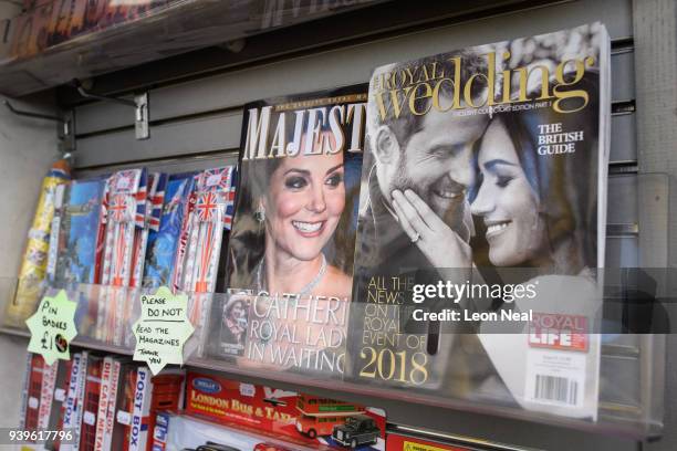 Magazine featuring an image of Prince Harry and Meghan Markle is seen on a trader's stall near Buckingham Palace on March 29, 2018 in London,...