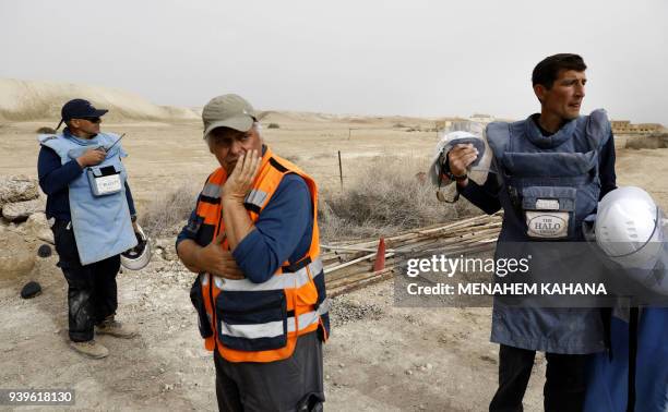 Employees of the HALO Trust, a UK-based non-profit demining organization, are seen on-site at Qasr al-Yahud in the occupied West Bank near the Jordan...