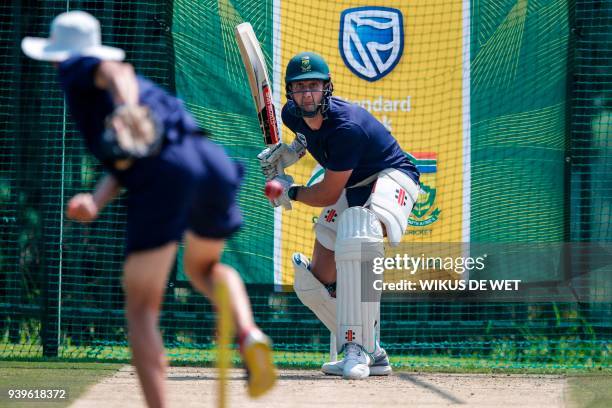 South African cricketer Theunis de Bruyn practices batting during a team practice session on March 29, 2018 in Johannesburg, in the midst of a...