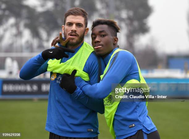 Davide Santon and Yann Karamoh of FC Internazionale pose for a photo during the FC Internazionale training session at the Angelo Moratti Sports...